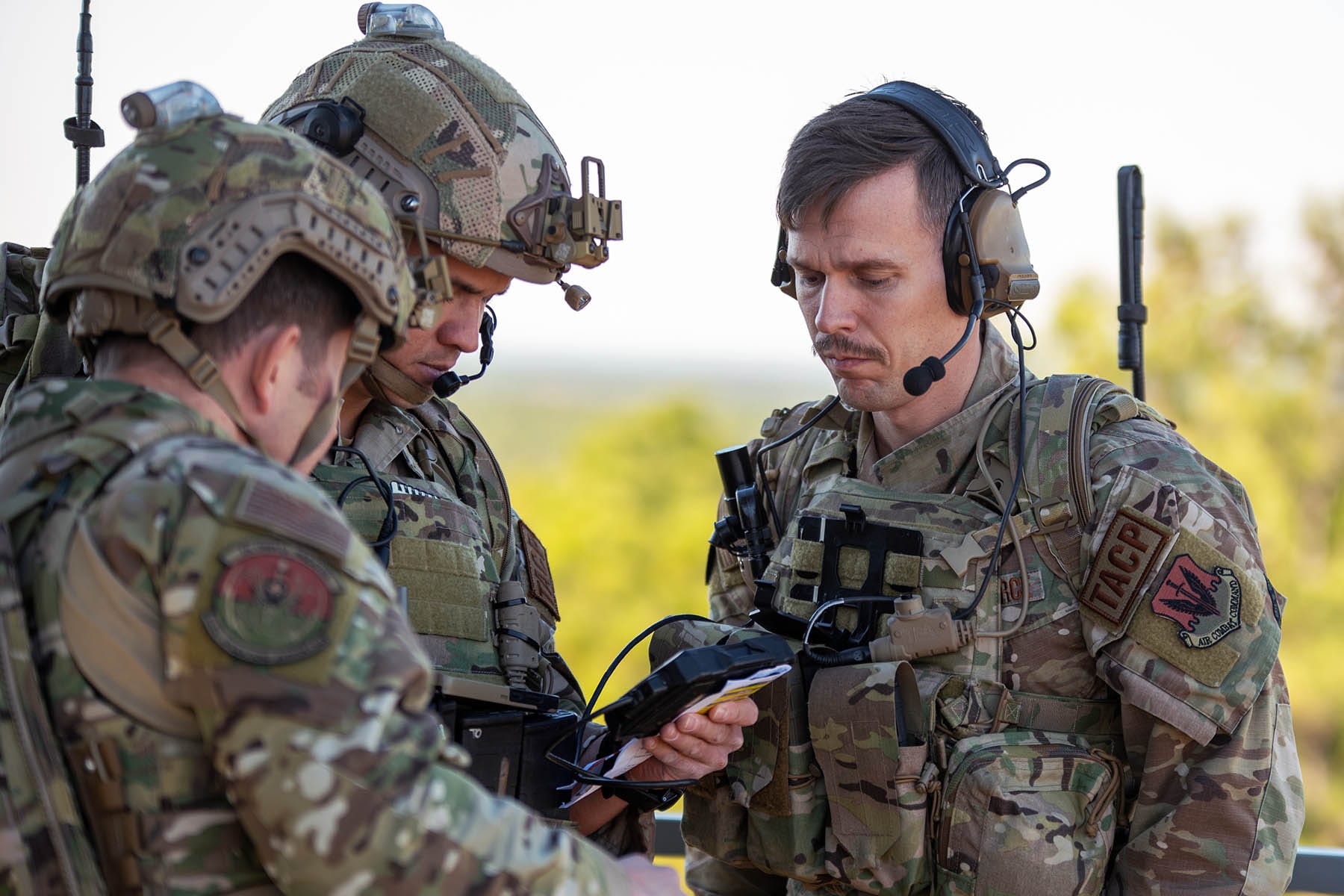 Air Force tactical air control party specialists assigned to 18th Air Support Operations Group coordinate air support during Scarlet Dragon at Fort Liberty, N.C., Dec. 7, 2023. 