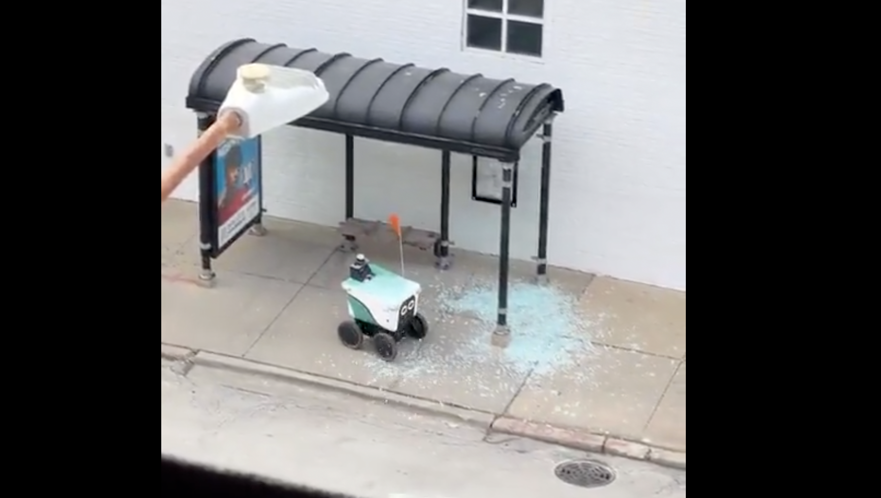 Delivery Robot Drives Through Bus Stop Shelter, Shattering Glass Everywhere